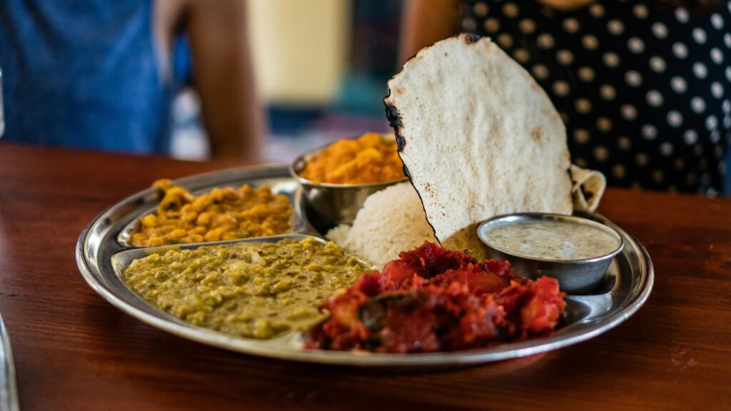 Thali showing dal, paneer, salad—protein needs Indian women"